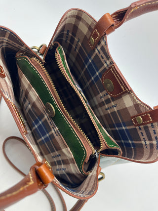 NORA  in pelle conciata al vegetale.