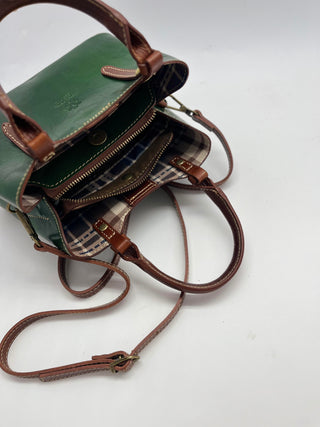 NORA  in pelle conciata al vegetale.